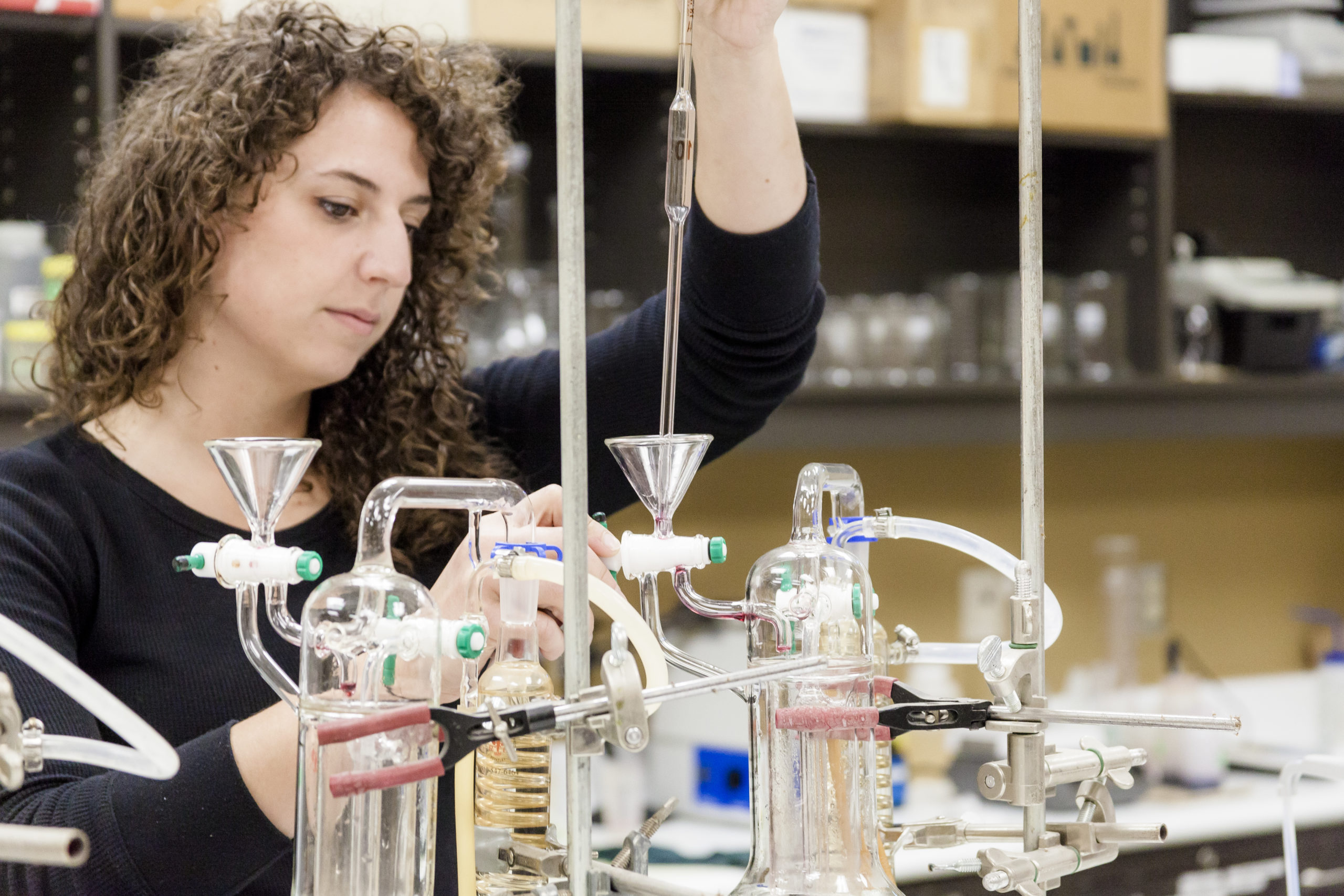 A lab technician ensuring wine quality